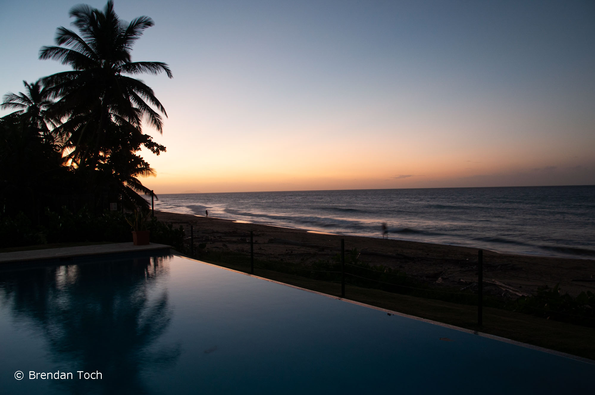 Rincon, Puerto Rico - The sun sets over Caribbean waters in a calm part of the day.